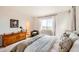 Comfortable main bedroom featuring a dresser, large window with view and an en suite bathroom at 3625 Silver Rock Cir, Castle Rock, CO 80104