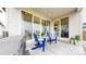 Outdoor patio features a seating area, glass sliding doors, and backyard views at 3625 Silver Rock Cir, Castle Rock, CO 80104