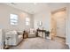 Bright second-floor landing offers a cozy seating area and neighborhood views from two windows at 3625 Silver Rock Cir, Castle Rock, CO 80104