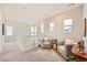 Open upper level landing featuring comfortable seating, natural light, and stylish decor at 3625 Silver Rock Cir, Castle Rock, CO 80104