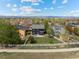 An aerial view displays a backyard, home, white fence and other homes in a residential neighborhood at 5249 Mt Arapaho Cir, Frederick, CO 80504