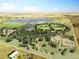 This aerial rendering shows a park with baseball fields, lakes, walking trails and a playground in a green landscape at 5249 Mt Arapaho Cir, Frederick, CO 80504