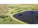 An aerial rendering shows a golf course, a lake, and homes in a suburban area at 5249 Mt Arapaho Cir, Frederick, CO 80504