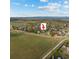 Overhead view of homes surrounded by a large green field, walking paths and landscaping at 5249 Mt Arapaho Cir, Frederick, CO 80504