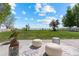 Serene backyard patio with cozy seating and view of lush green space at 5249 Mt Arapaho Cir, Frederick, CO 80504