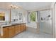 Bathroom features a dual sink vanity, soaking tub, and glass enclosed shower at 5249 Mt Arapaho Cir, Frederick, CO 80504