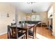 Open dining area with hardwood floors, and open to living room and kitchen at 5249 Mt Arapaho Cir, Frederick, CO 80504