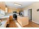 Well-equipped kitchen with center island, stainless steel appliances, and ample cabinet space at 5249 Mt Arapaho Cir, Frederick, CO 80504
