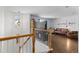 Upstairs landing with hardwood floors and living area at 5249 Mt Arapaho Cir, Frederick, CO 80504