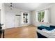Bright living room with hardwood floors, large windows, and a comfortable blue couch at 5249 Mt Arapaho Cir, Frederick, CO 80504