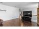 Bright living room with hardwood floors, white walls, and staircase access at 5249 Mt Arapaho Cir, Frederick, CO 80504