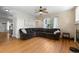 Bright living room with hardwood floors, stylish decor, and large sectional sofa at 5249 Mt Arapaho Cir, Frederick, CO 80504