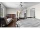 Spacious main bedroom featuring a ceiling fan, chaise lounge, and closet access at 5249 Mt Arapaho Cir, Frederick, CO 80504