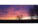 Beautiful vibrant sunset sky illuminating the horizon, creating a colorful backdrop over a serene landscape at 5249 Mt Arapaho Cir, Frederick, CO 80504