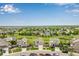 Aerial view of home and neighborhood highlighting the green space and proximity to nearby amenities at 6990 E 132Nd Pl, Thornton, CO 80602