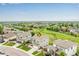 Aerial view of the property showcasing its location within a neighborhood and nearby golf course at 6990 E 132Nd Pl, Thornton, CO 80602
