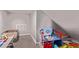 Cozy attic space featuring neutral walls and carpet, with dedicated play area at 6990 E 132Nd Pl, Thornton, CO 80602