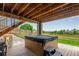 Back deck and hot tub with wood fencing at 6990 E 132Nd Pl, Thornton, CO 80602