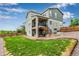 Spacious, grassy backyard with wood fencing and access to the upper deck at 6990 E 132Nd Pl, Thornton, CO 80602