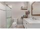 Modern bathroom with glass-enclosed shower, toilet, vanity with marble countertop and shelving for storage at 6990 E 132Nd Pl, Thornton, CO 80602