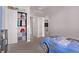 Cozy bedroom features closet space, and car-themed bed at 6990 E 132Nd Pl, Thornton, CO 80602