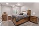 Cozy bedroom featuring a wooden bed frame, neutral walls and carpet, and window with light-filtering blinds at 6990 E 132Nd Pl, Thornton, CO 80602