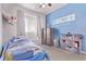 bedroom features a whimsical theme and a window seat at 6990 E 132Nd Pl, Thornton, CO 80602