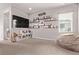 Bonus room with a large TV and ample seating at 6990 E 132Nd Pl, Thornton, CO 80602