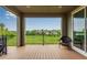 Covered deck featuring wood floors, black railings, and a seating area with neighborhood views at 6990 E 132Nd Pl, Thornton, CO 80602