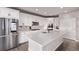 Well-equipped kitchen with stainless steel appliances, a large island, and ample cabinet space at 6990 E 132Nd Pl, Thornton, CO 80602