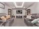 Cozy living room featuring comfortable seating, a TV, and elegant decor for a relaxing atmosphere at 6990 E 132Nd Pl, Thornton, CO 80602