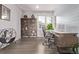 Well-lit home office featuring custom shelves, desk, and stylish decor at 6990 E 132Nd Pl, Thornton, CO 80602