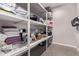 Walk-in storage closet with ample shelving for optimal organization at 6990 E 132Nd Pl, Thornton, CO 80602