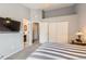 Bedroom with closet access and an en-suite bathroom at 2800 W Centennial Dr # I, Littleton, CO 80123