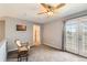 Inviting bedroom offers natural light, a rocking chair, and access to an outdoor balcony, perfect for relaxation at 2800 W Centennial Dr # I, Littleton, CO 80123