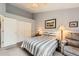 Comfortable bedroom featuring neutral colors, a ceiling fan and a large closet for ample storage at 2800 W Centennial Dr # I, Littleton, CO 80123