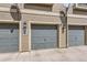 Garages for the townhomes, with visible street numbers at 2800 W Centennial Dr # I, Littleton, CO 80123