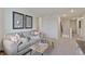 Cozy upstairs sitting area with comfortable seating and neutral decor at 6513 14Th St, Frederick, CO 80530