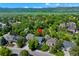 Aerial view of the property showcasing its location within a lush, tree-filled neighborhood at 7773 Gunsight Pass, Littleton, CO 80127