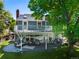 Spacious backyard features a large deck, outdoor seating and manicured lawn at 7773 Gunsight Pass, Littleton, CO 80127