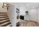 A basement kitchenette featuring white cabinets and appliances adds convenience, with stairs leading to the main level at 7773 Gunsight Pass, Littleton, CO 80127