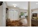 Bright foyer with hardwood floors, a large window, and an elegant entryway bench at 7773 Gunsight Pass, Littleton, CO 80127