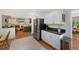 Open kitchen with stainless steel appliances and views of the adjacent living room at 7773 Gunsight Pass, Littleton, CO 80127