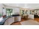 Eat-in kitchen with stainless steel appliances, dark counters, and a view of the backyard at 7773 Gunsight Pass, Littleton, CO 80127