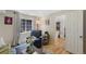Comfortable living room with a modern area rug, cozy chair and large window at 7773 Gunsight Pass, Littleton, CO 80127