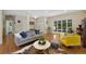 Spacious living room with hardwood floors, stylish furniture, and plenty of natural light at 7773 Gunsight Pass, Littleton, CO 80127