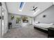 Spacious main bedroom includes skylights, modern fireplace, wall-mounted television, and exterior access at 7773 Gunsight Pass, Littleton, CO 80127
