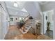 Elegant staircase with wooden rails and wrought iron spindles, leading to the upper level at 7773 Gunsight Pass, Littleton, CO 80127