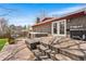 Relaxing backyard featuring a hot tub, grill and egg chair next to the house on a wood deck at 8320 W Harvard Dr, Lakewood, CO 80227