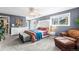 Spacious bedroom with decorative headboard and matching dressers, bright natural light and calming gray walls at 8320 W Harvard Dr, Lakewood, CO 80227